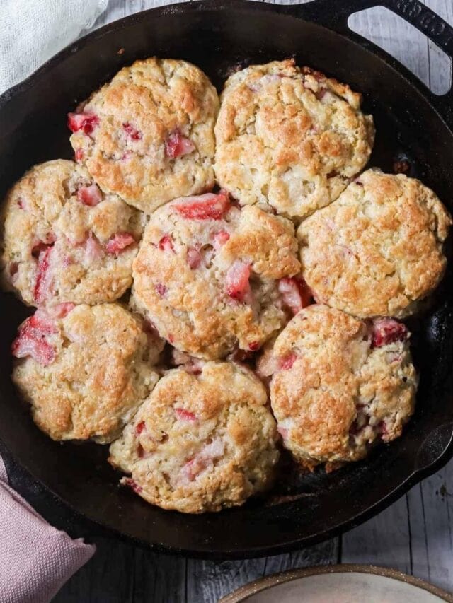 strawberry buttermilk biscuits in a cast iron skillet