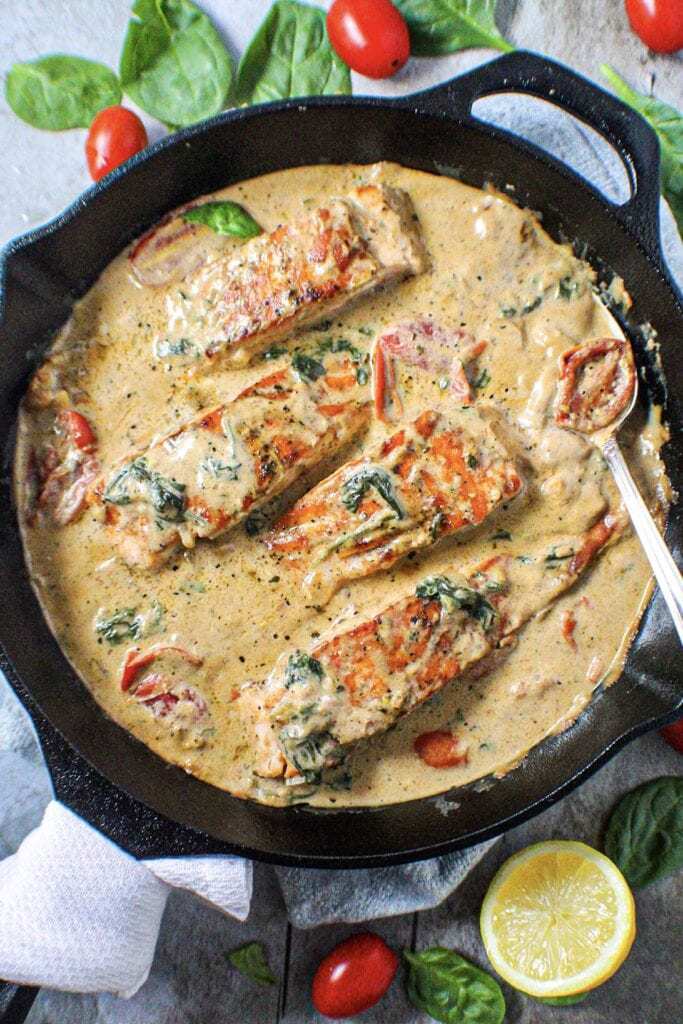 Creamy Garlic Tuscan Salmon in cast iron skillet