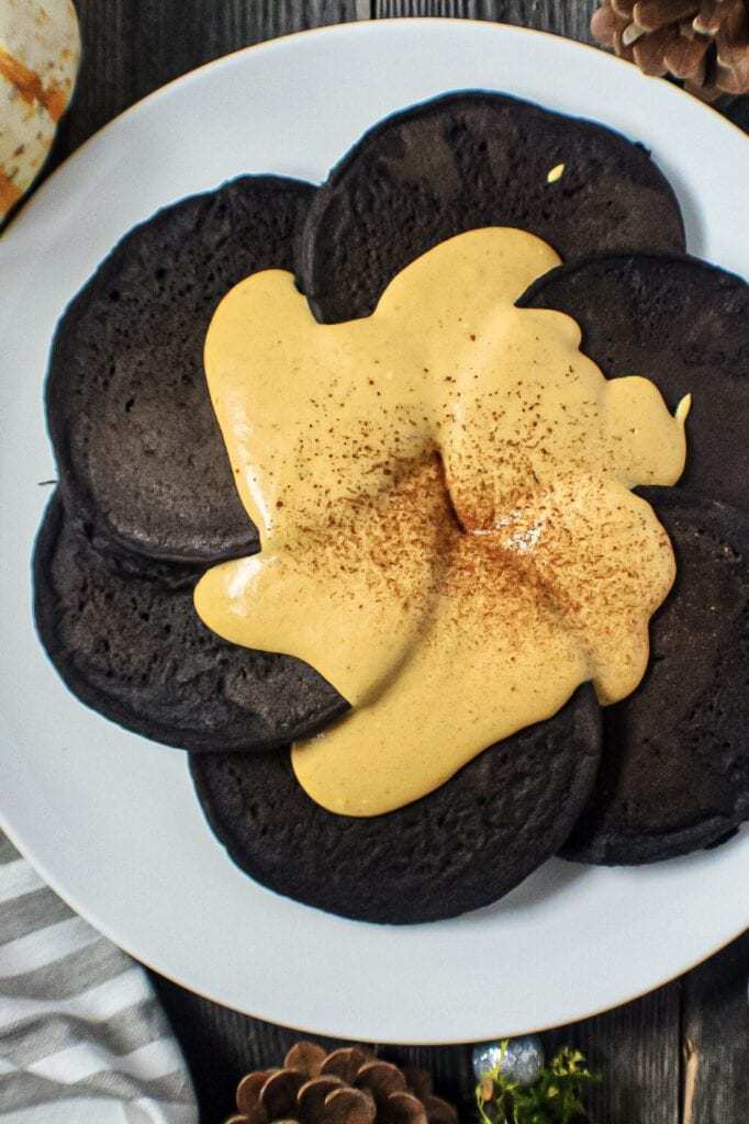 dark chocolate pancakes with pumpkin cream cheese glaze