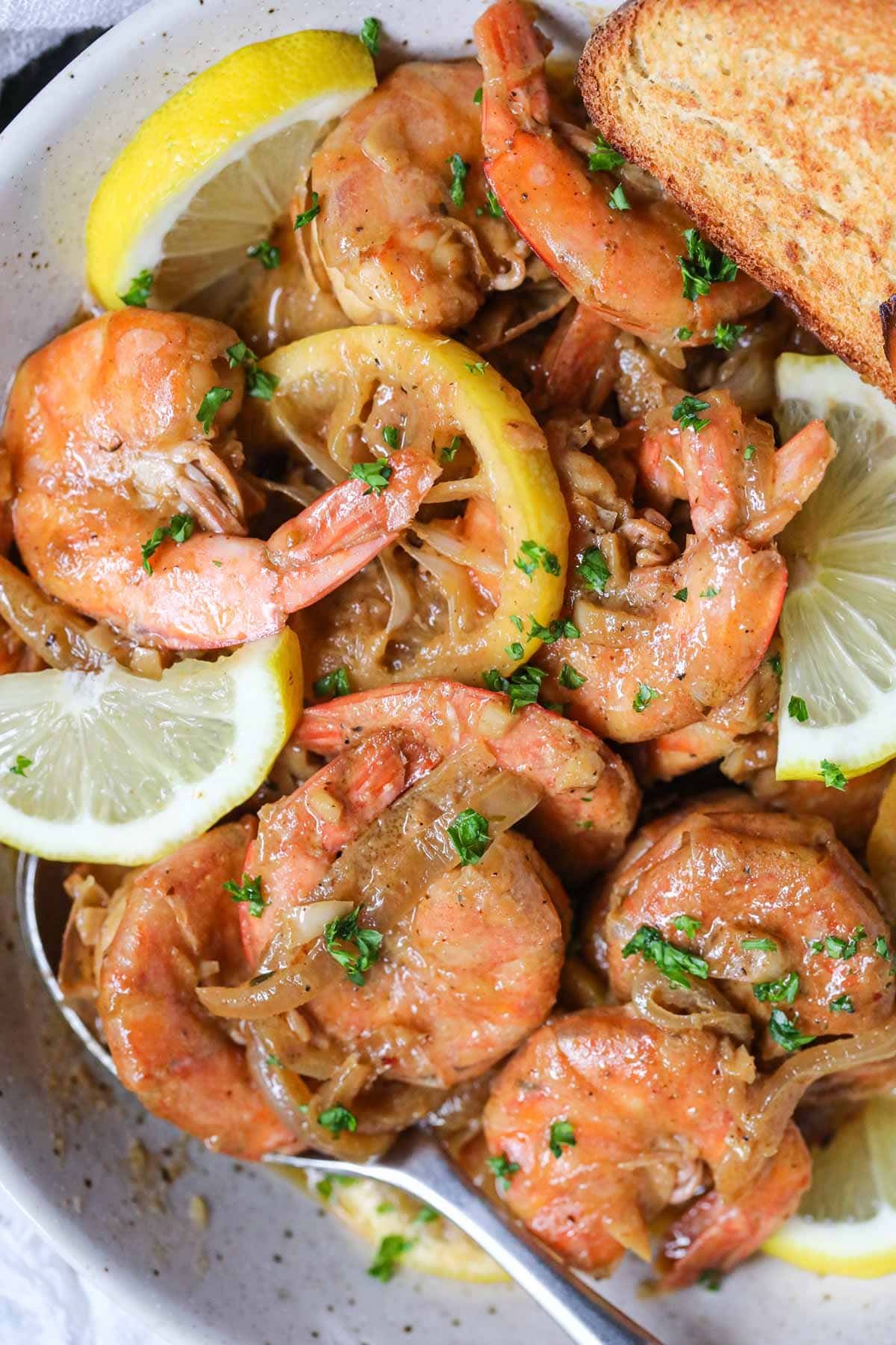 New Orleans barbecue shrimp in a white bowl.