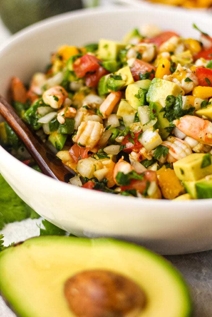close up of Avocado, shrimp and mango ceviche in white bowl