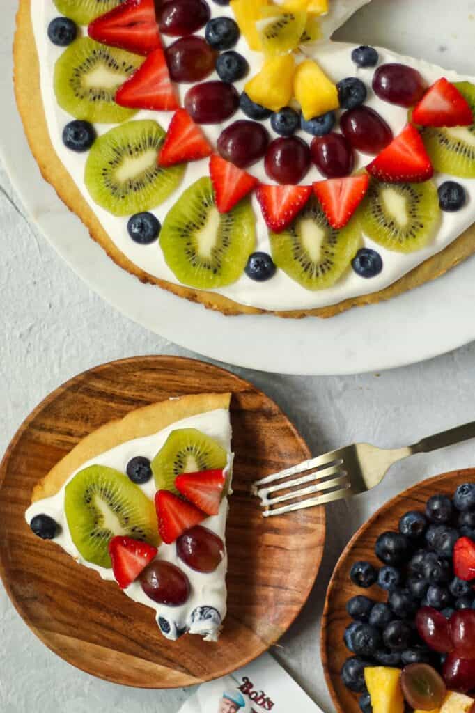 overhead shot of sliced gluten-free fruit pizza