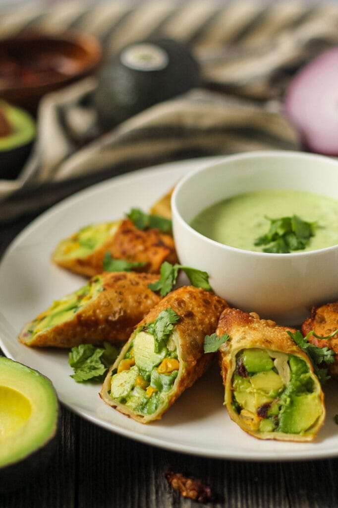 side angle shot of avocado egg rolls