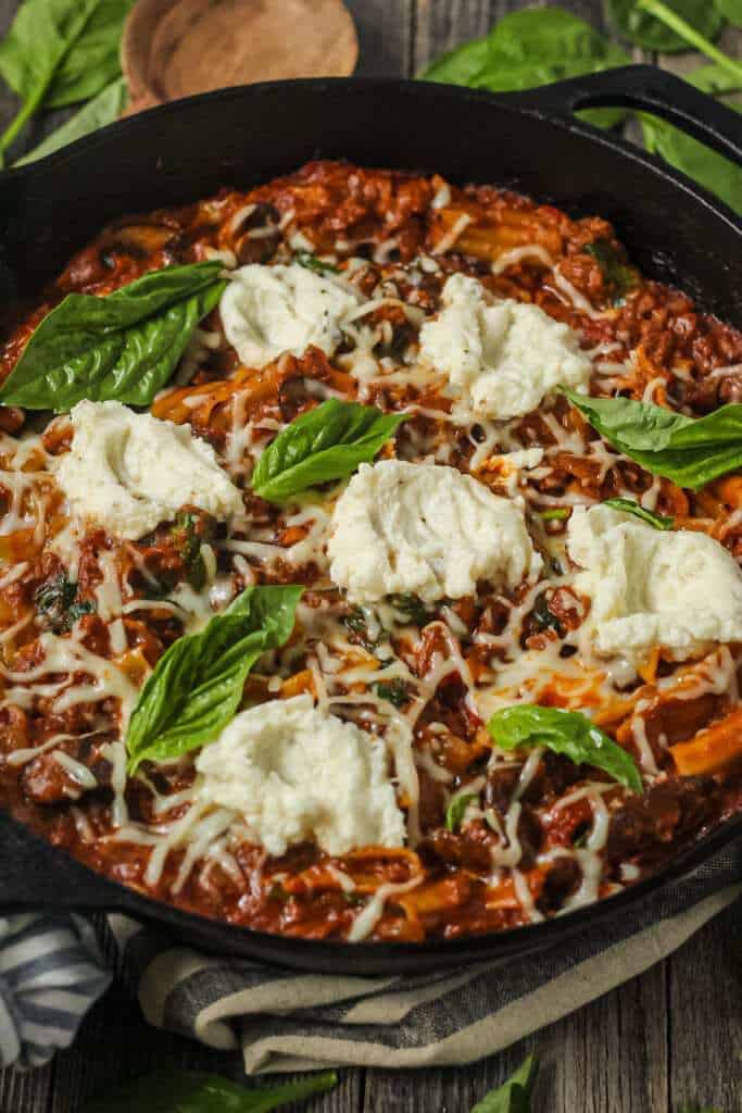 side angle shot of skillet lasagna in cast iron skillet.