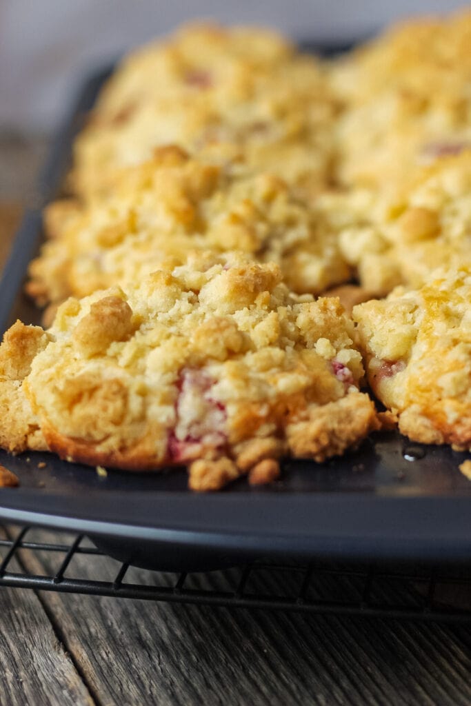 close up shot of strawberry crumble muffins in muffin pan