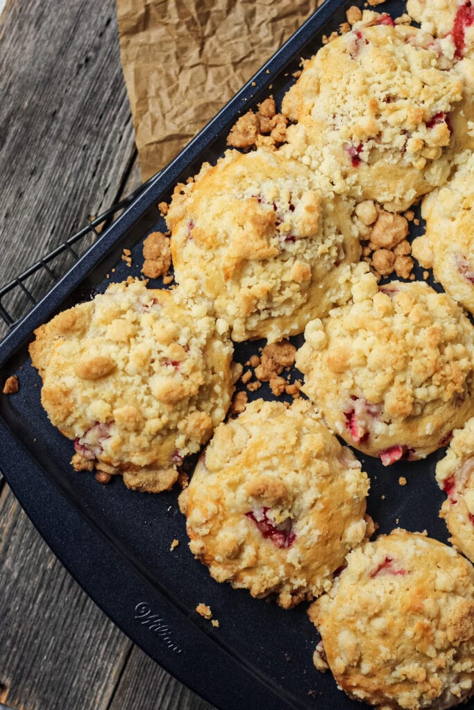 overhead shot of strawberry crumble muffins in muffin pan