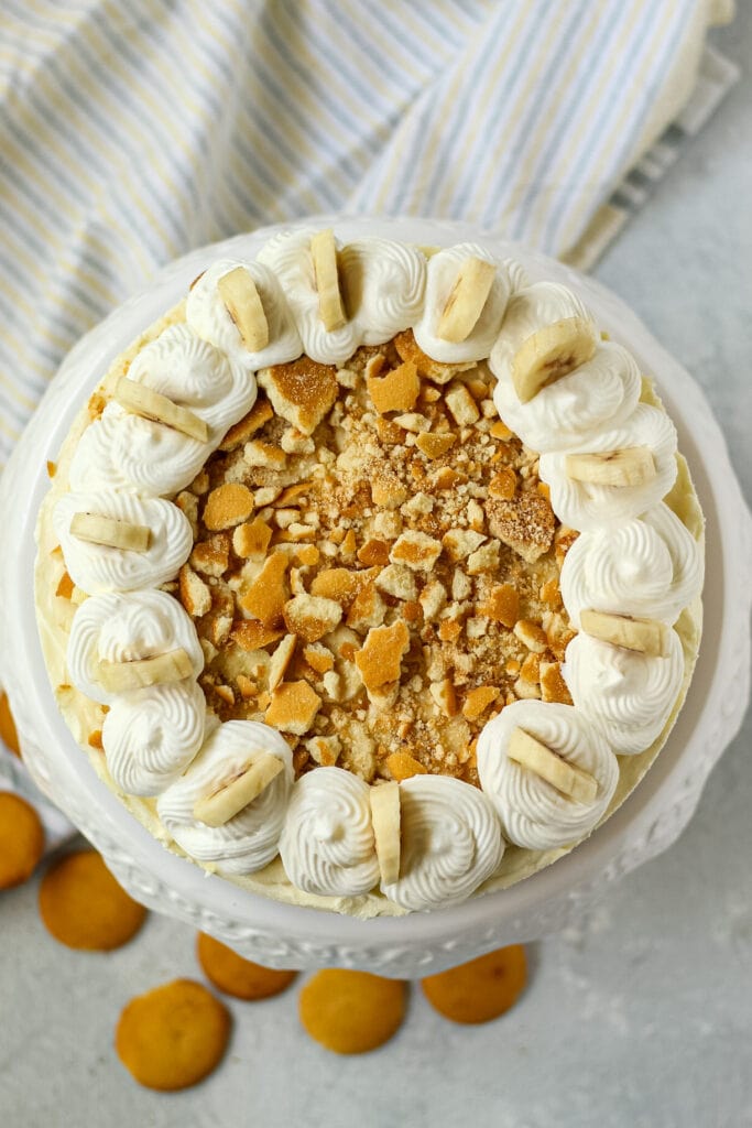overhead shot of banana pudding icebox pie on white cake stand