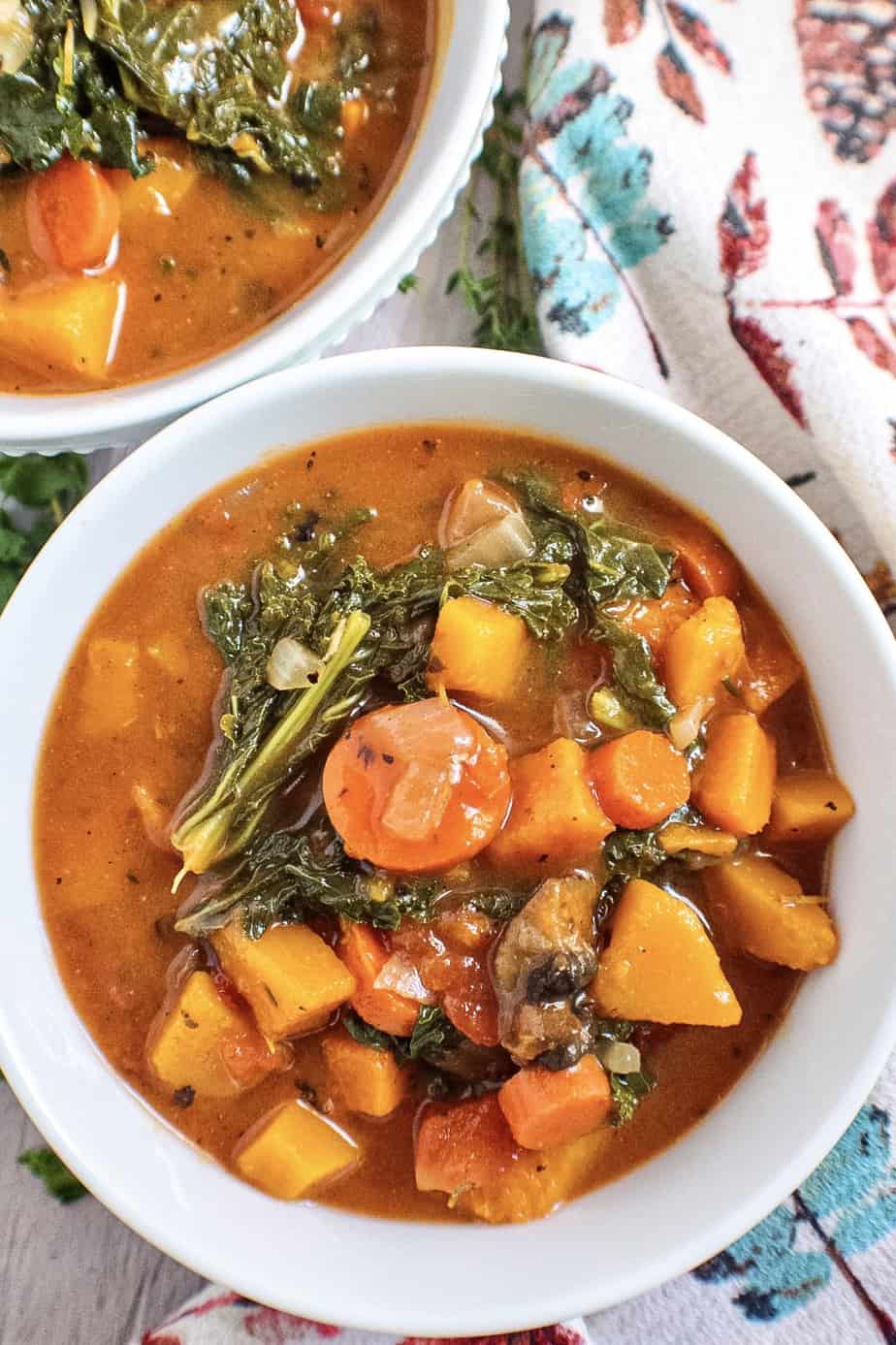 overhead shot of vegetable soup in white bowl.