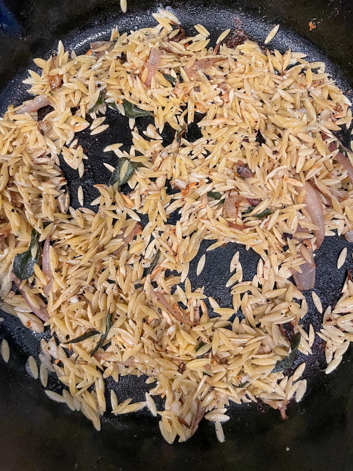 orzo browning in cast iron skillet