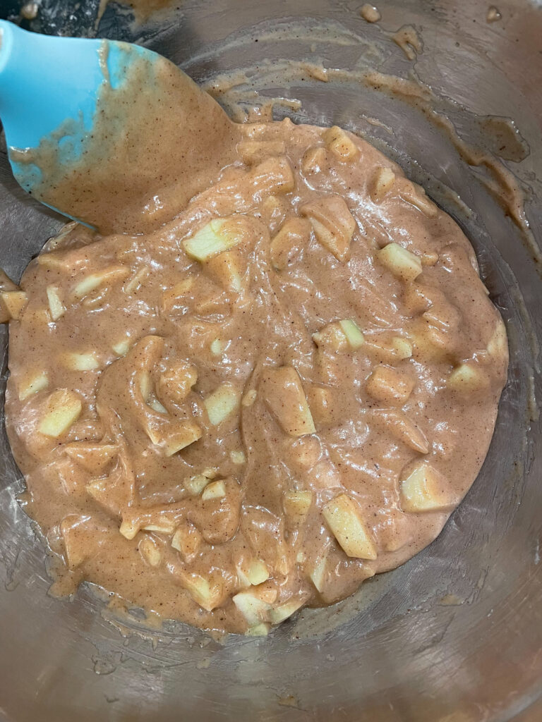 cake batter with apples mixed in