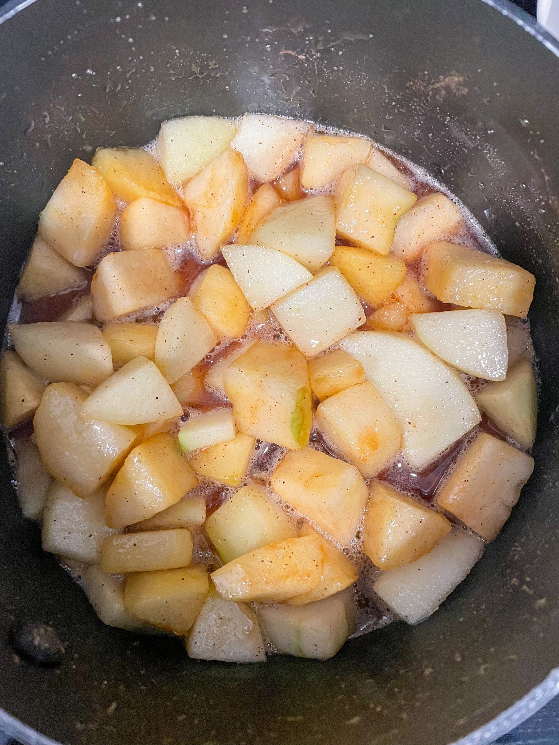 overhead shot of apples, sugar, an spices in pan for jam