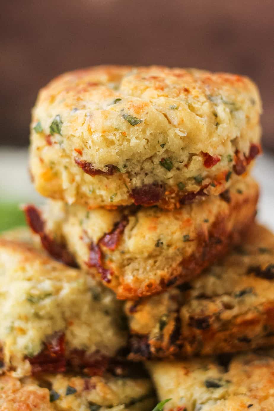 close up shot of sun-dried tomato, cheddar, and herb biscuits.  