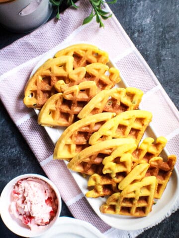 overhead shot ofJalapeño cornbread waffles with strawberry butter