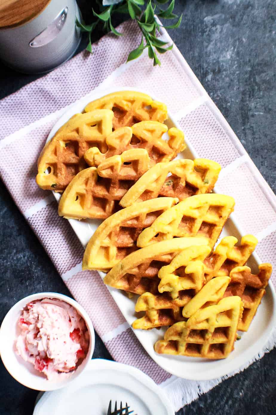 overhead shot ofJalapeño cornbread waffles with strawberry butter