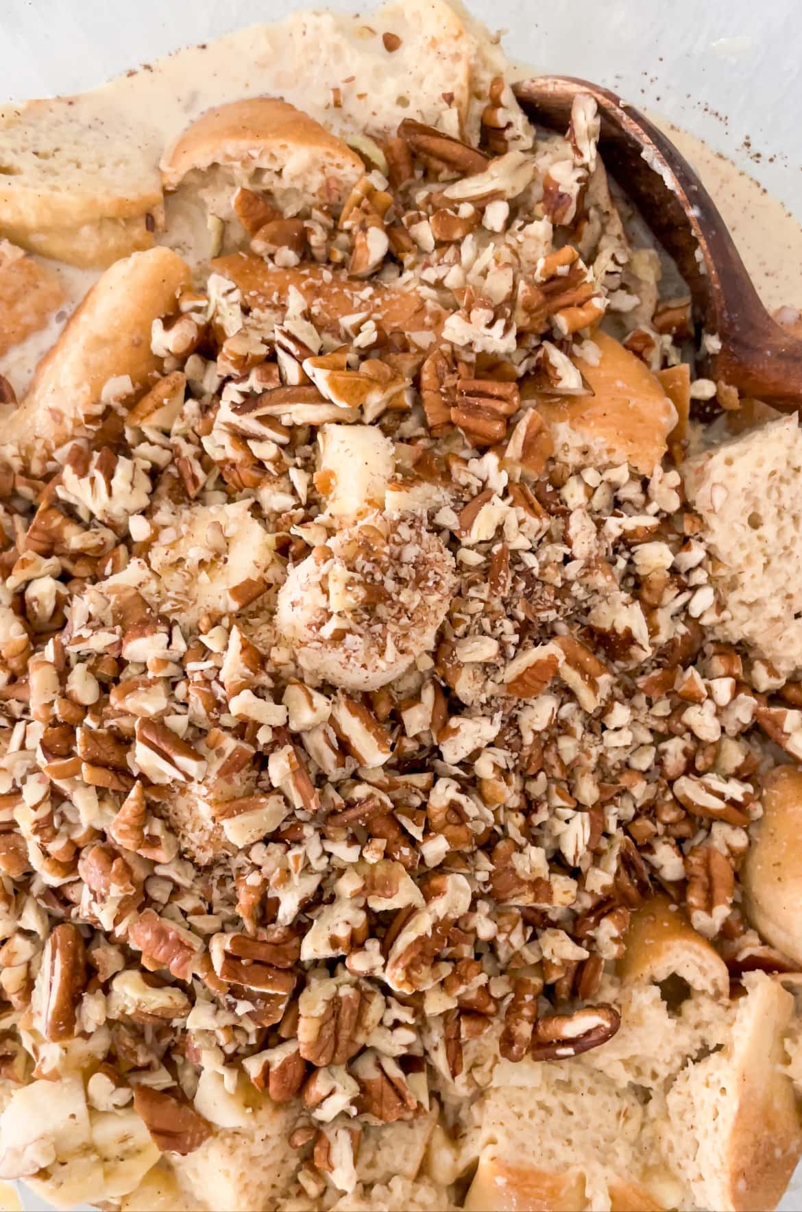 bread pudding with pecans and bananas in bowl