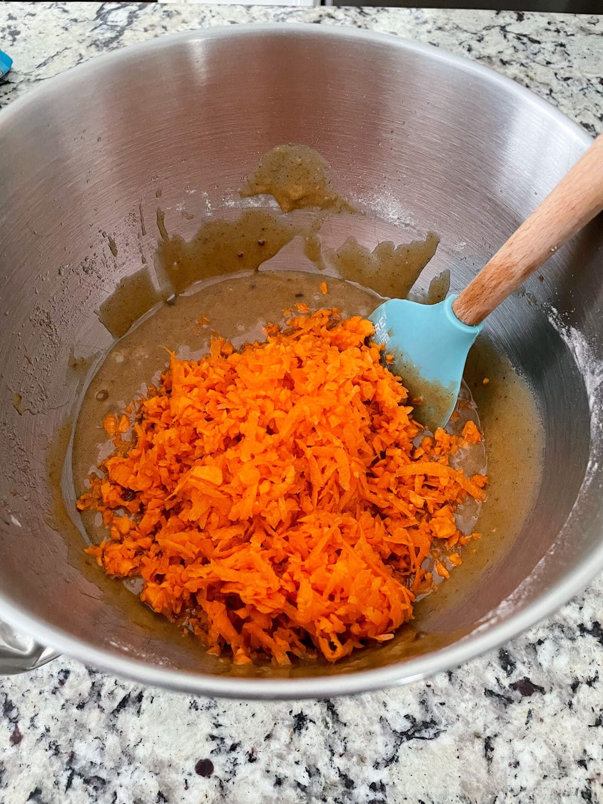 carrot cake batter with carrots in a bowl