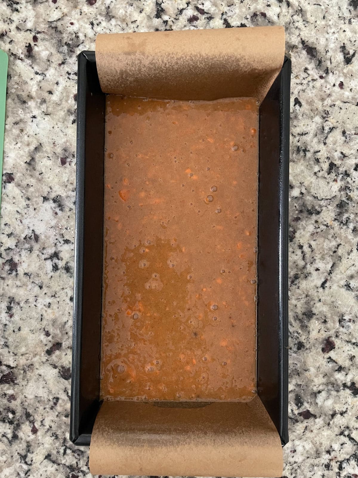 carrot cake batter in a loaf pan