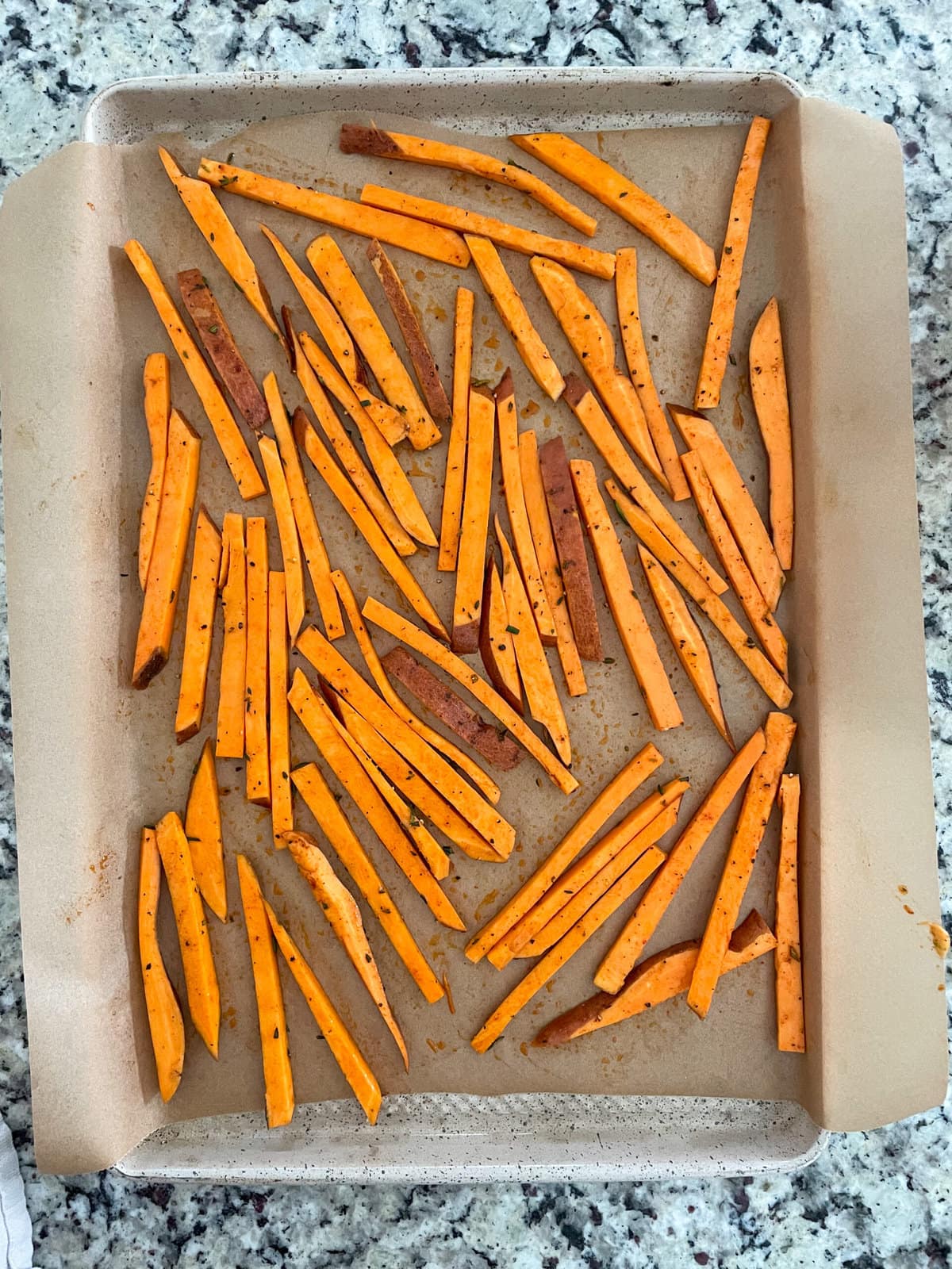 sweet potato fries on a baking sheet