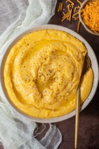 creamy southern cheese grits in white bowl