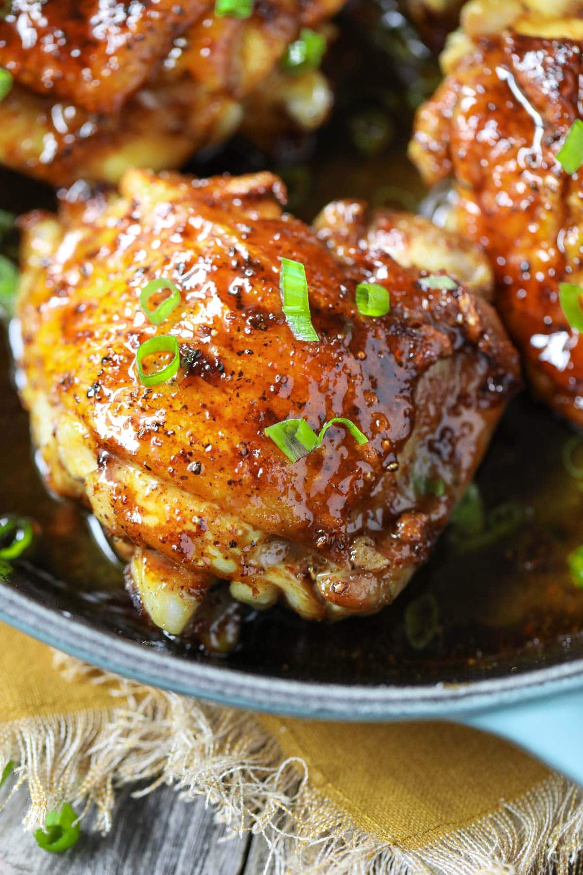 brown sugar glazed chicken in a cast-iron skillet.