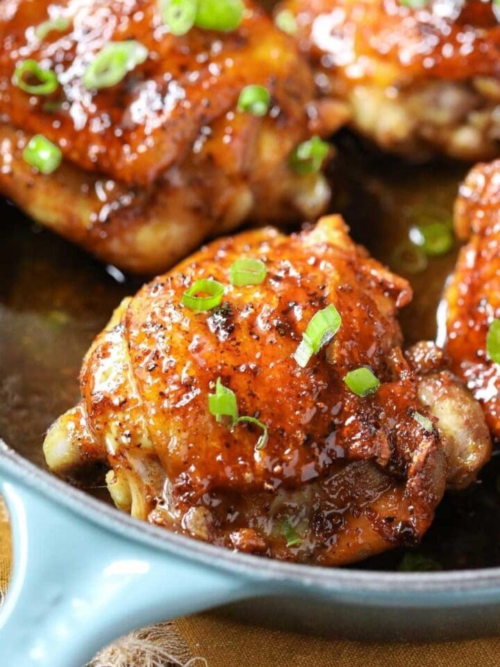 brown sugar glazed chicken in a cast-iron skillet.