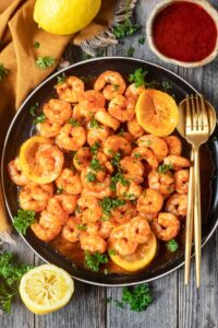 cajun honey butter shrimp on black plate