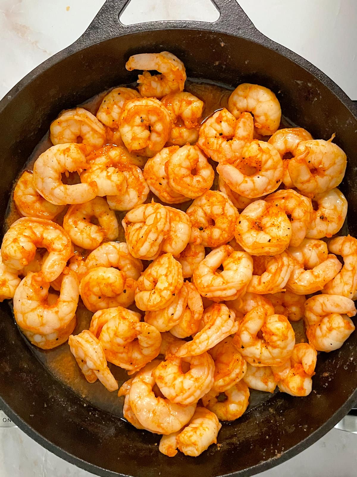 shrimp cooking in skillet