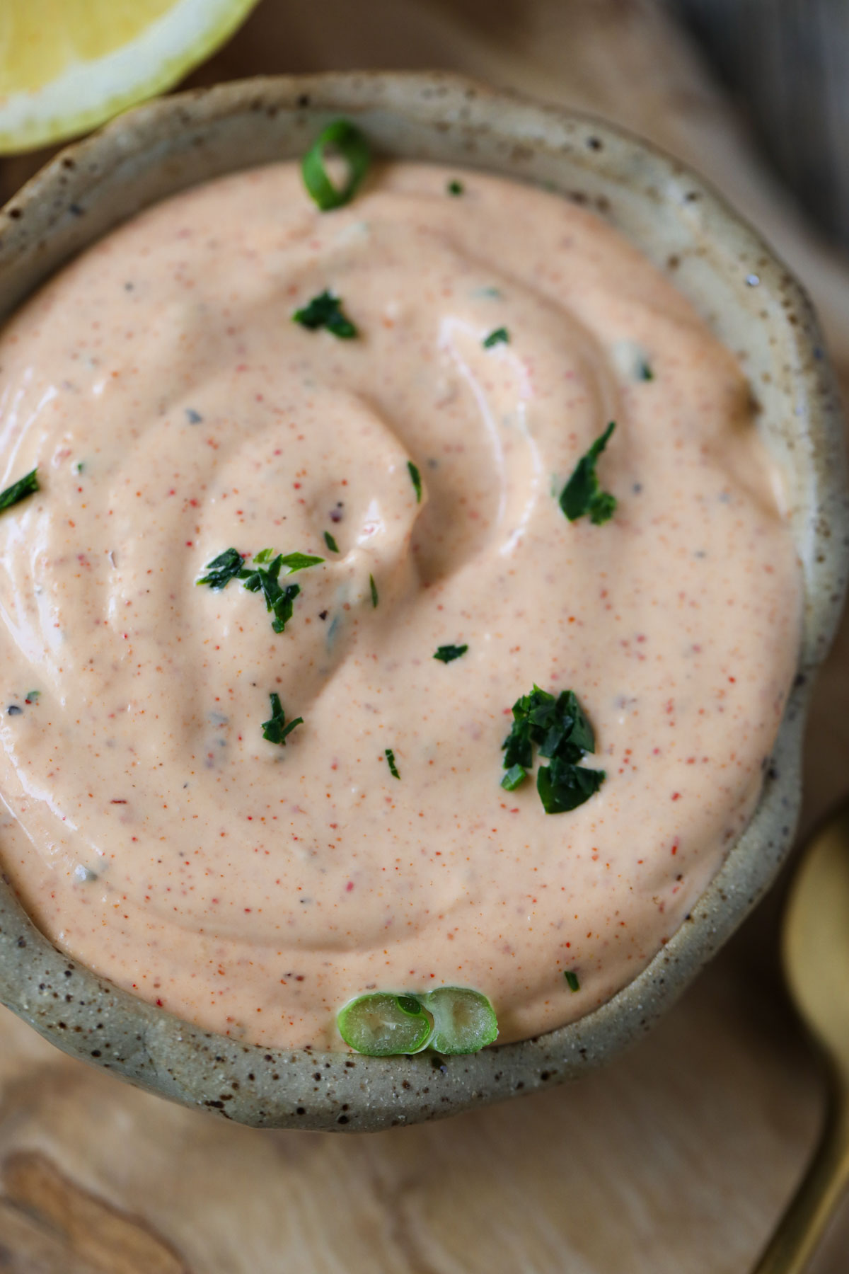 creamy cajun dipping sauce in a brown bowl.