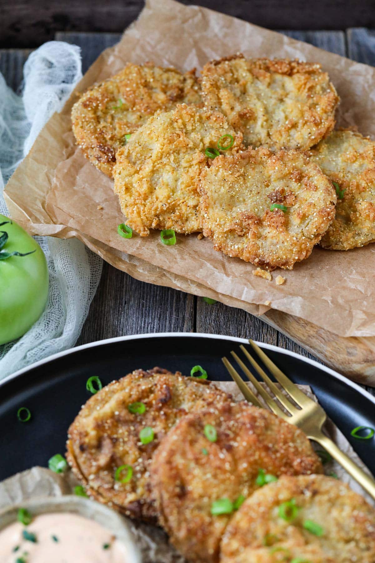 fried green tomatoes on parchment paper.