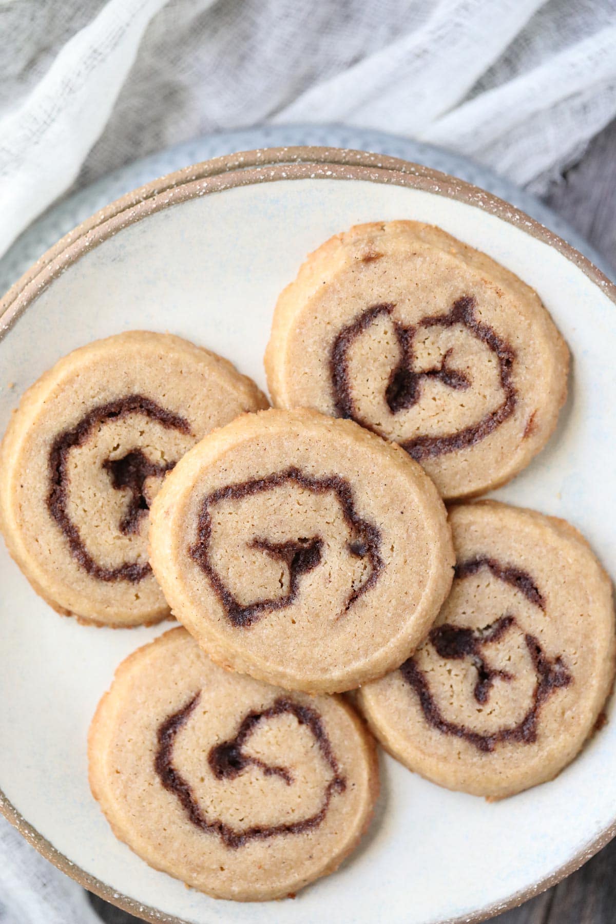 cinnamon roll cookies on a gray plate.