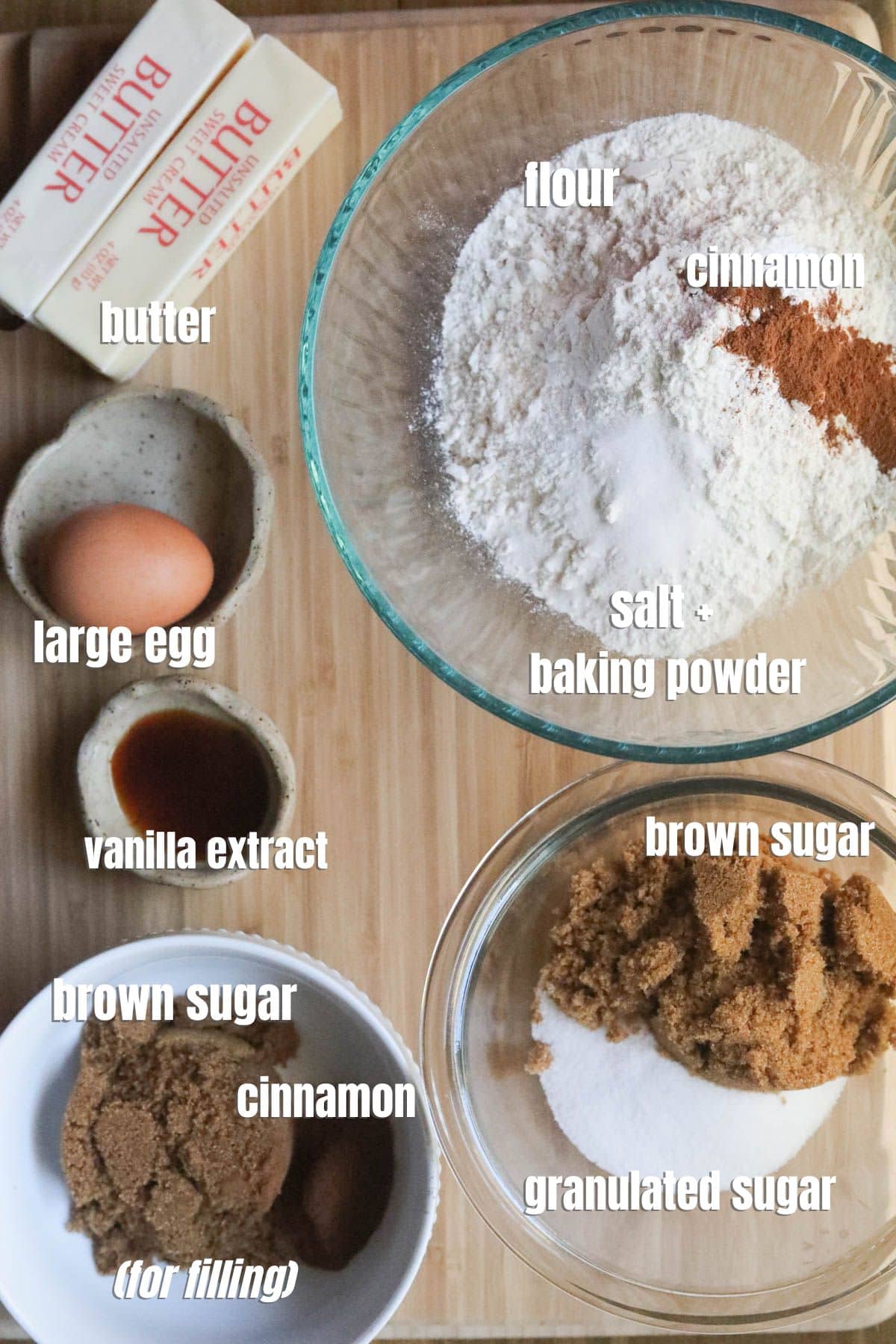 cinnamon roll ingredients spread out on a cutting board.