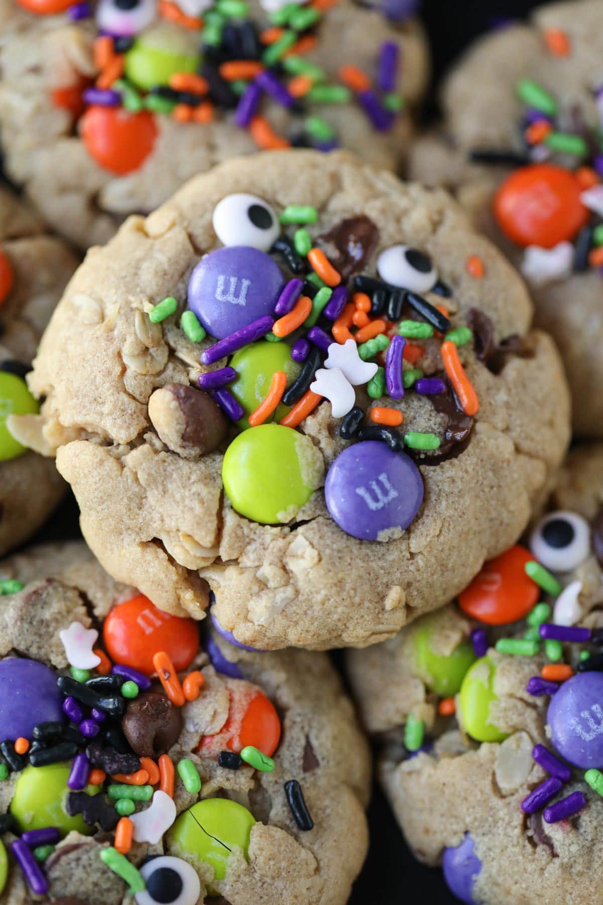 monster cookies arranged on a plate.