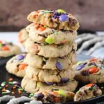 monster cookies stacked on a black plate.