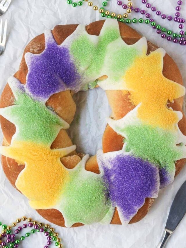 Mardi Gras New Orleans king cake find a white surface.