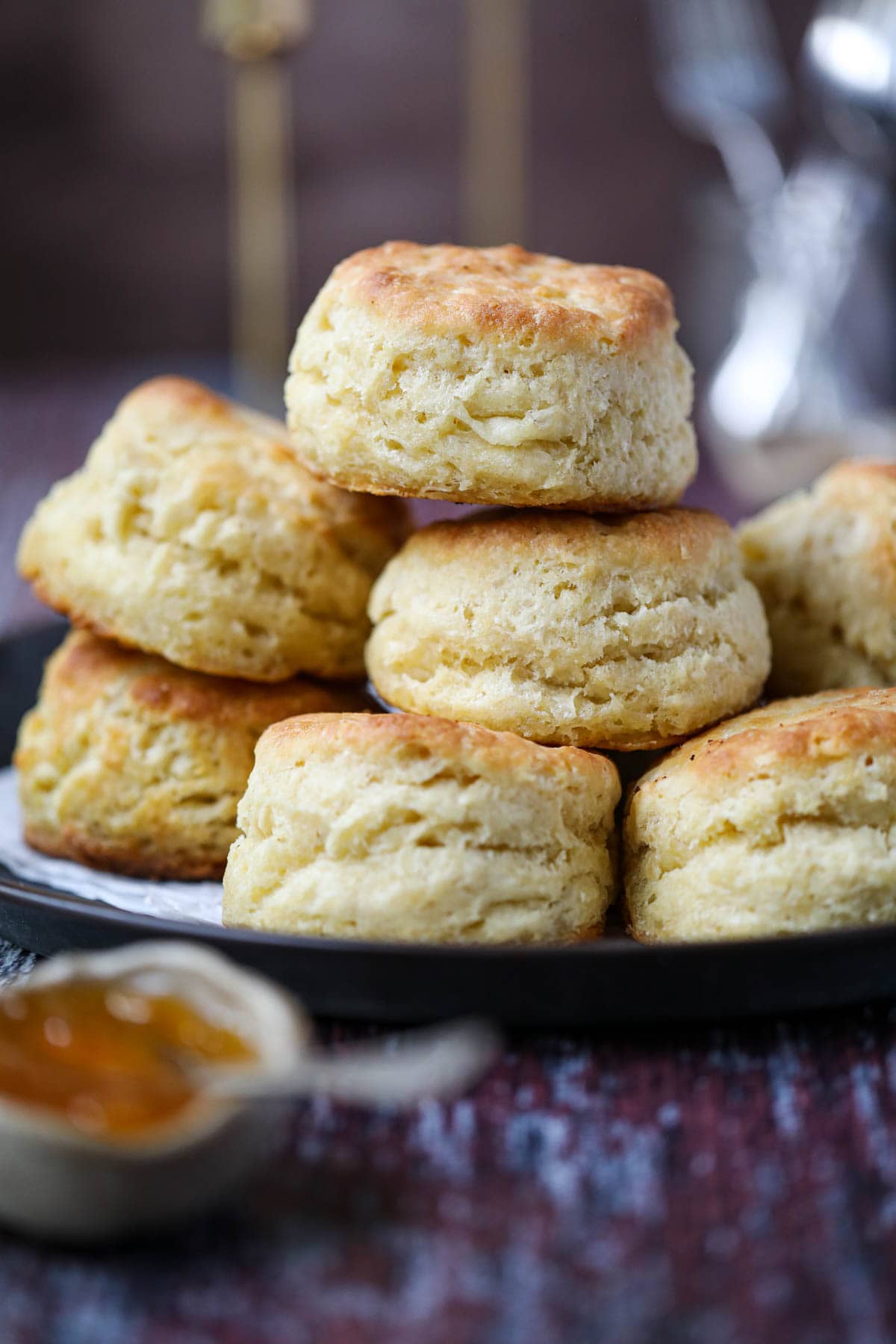 southern buttermilk biscuits stacked on a tray.
