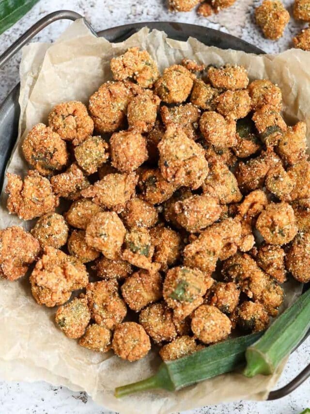 Southern fried okra on a metal tray sitting on a white surface.