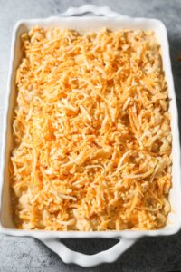southern mac and cheese in a baking dish before being baked.
