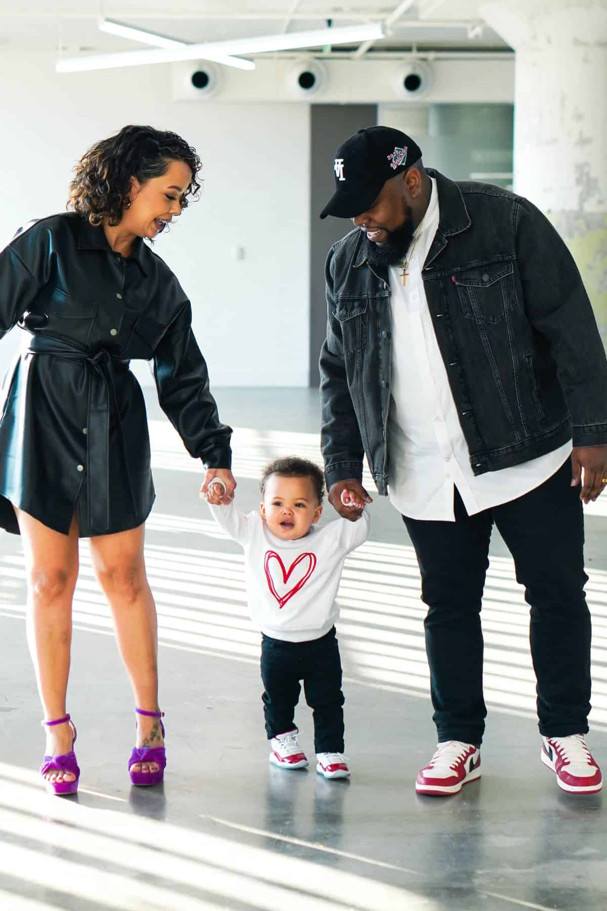 ashley boyd, her son, and husband posing for a family photo.