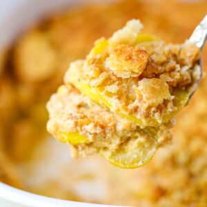 A serving of Southern squash casserole on a serving spoon.