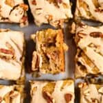 maple pecan blondies sliced with one slice turned on side to show detail.