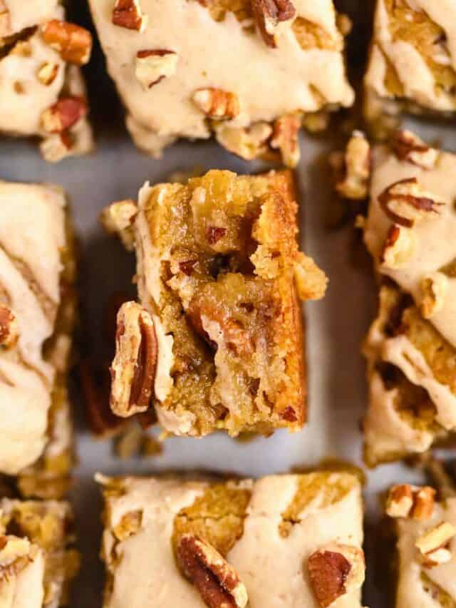 maple pecan blondies sliced with one slice turned on side to show detail.