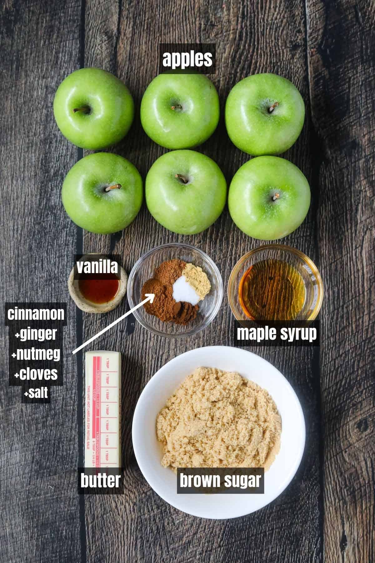 Ingredients for making southern fried apples arranged on a wooden surface.