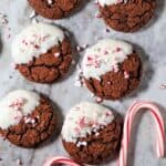 Peppermint bark brownie cookies arranged on a marble surface.