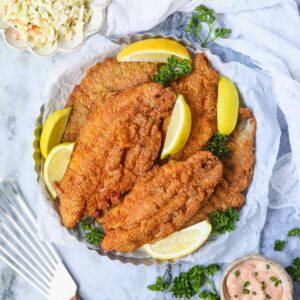 Southern fried catfish in a metal tray.