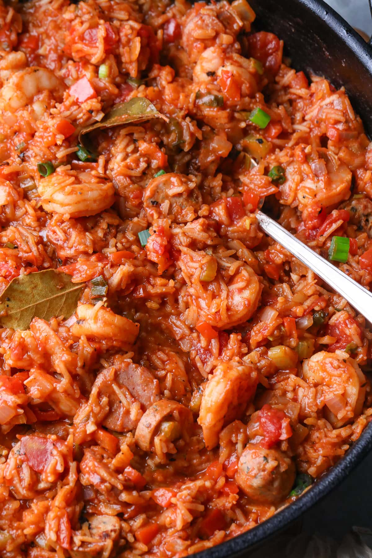 Close-up photo of shrimp and sausage jambalaya in a skillet.