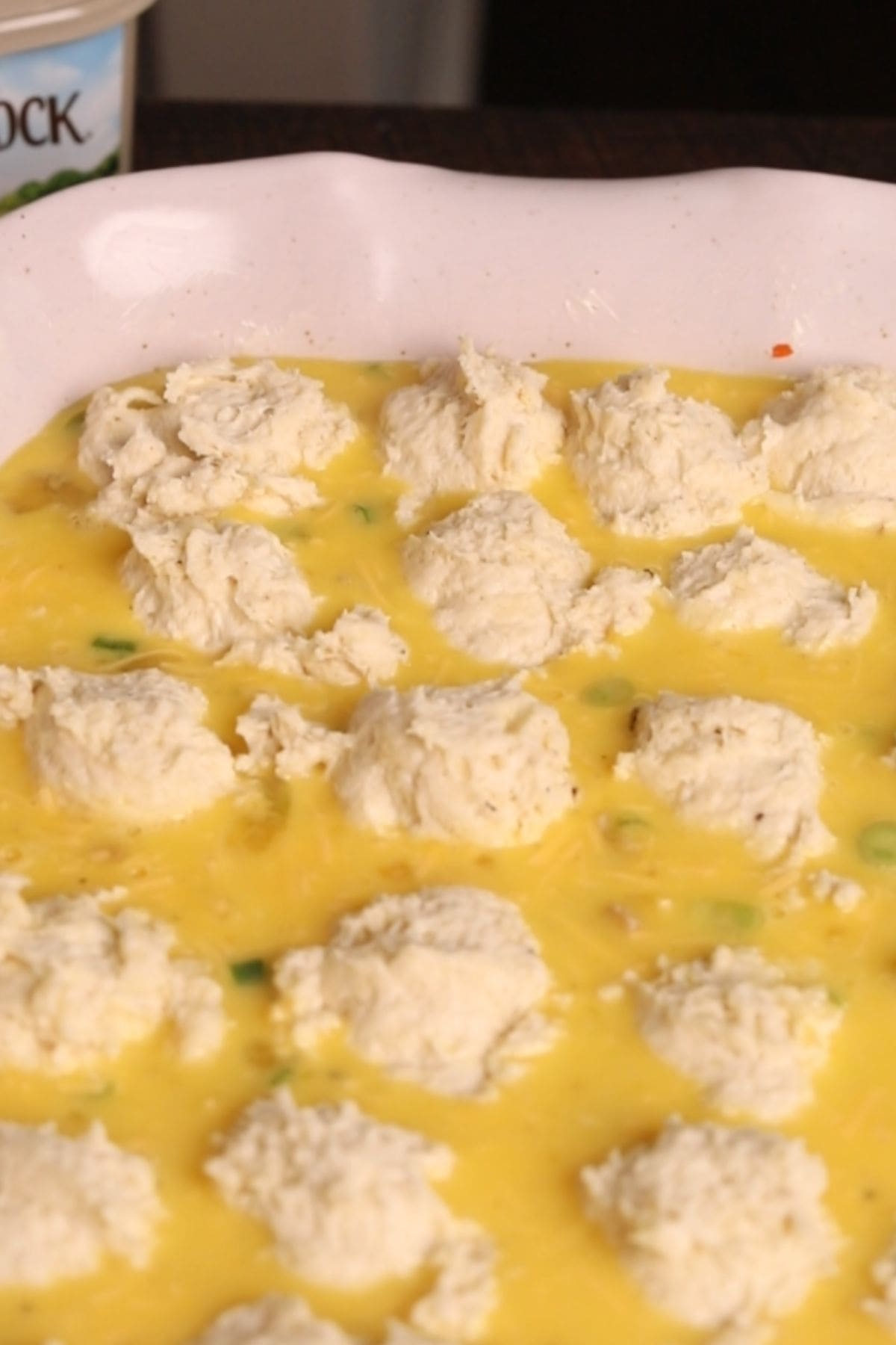 Buttermilk biscuit breakfast casserole before going in the oven.
