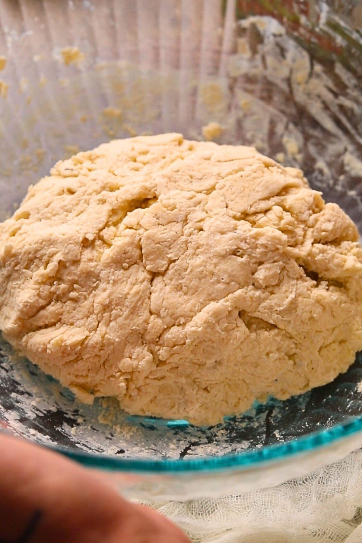 Buttermilk biscuit dough in a mixing bowl.