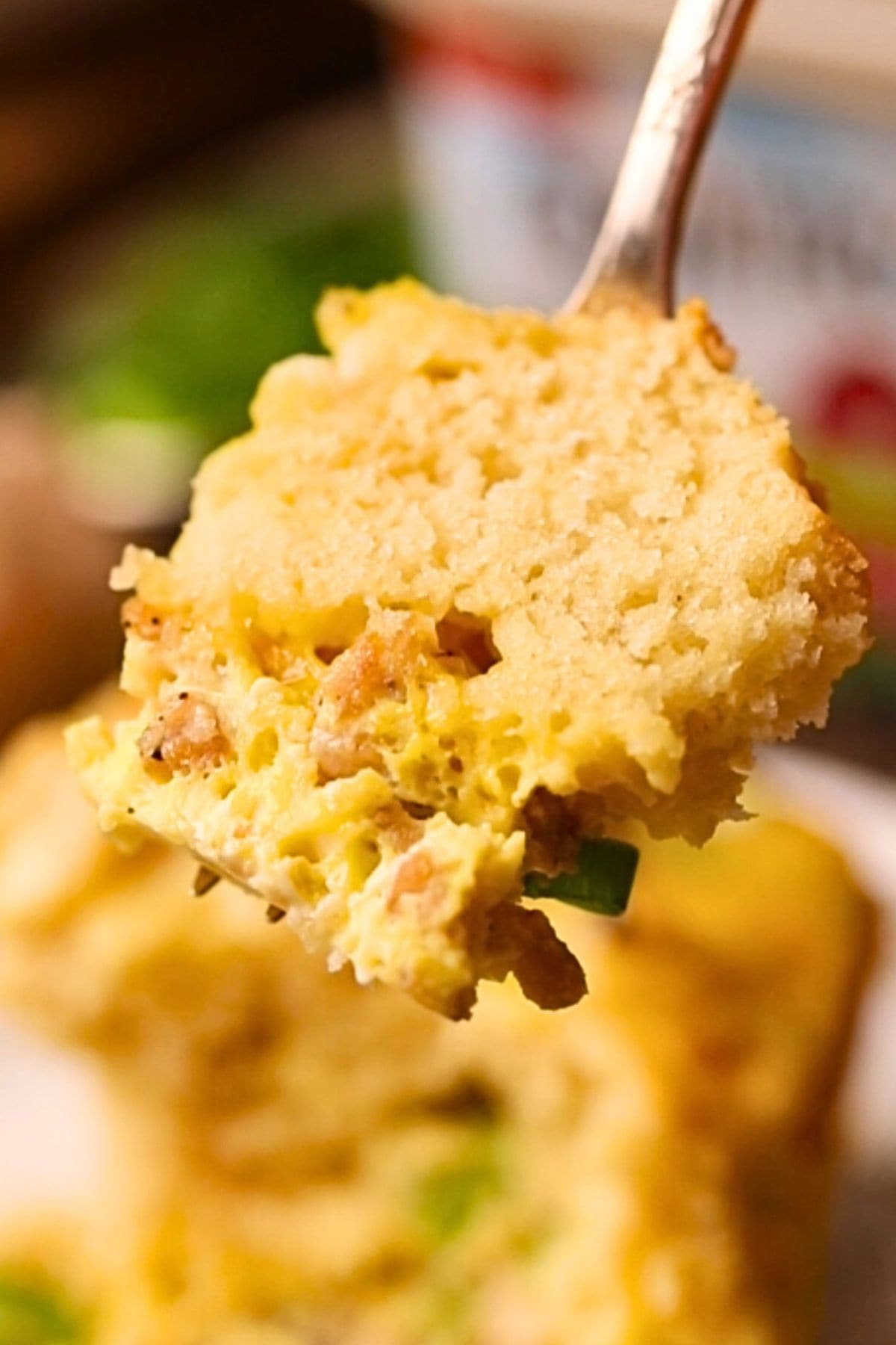 Buttermilk biscuit breakfast casserole on a fork.
