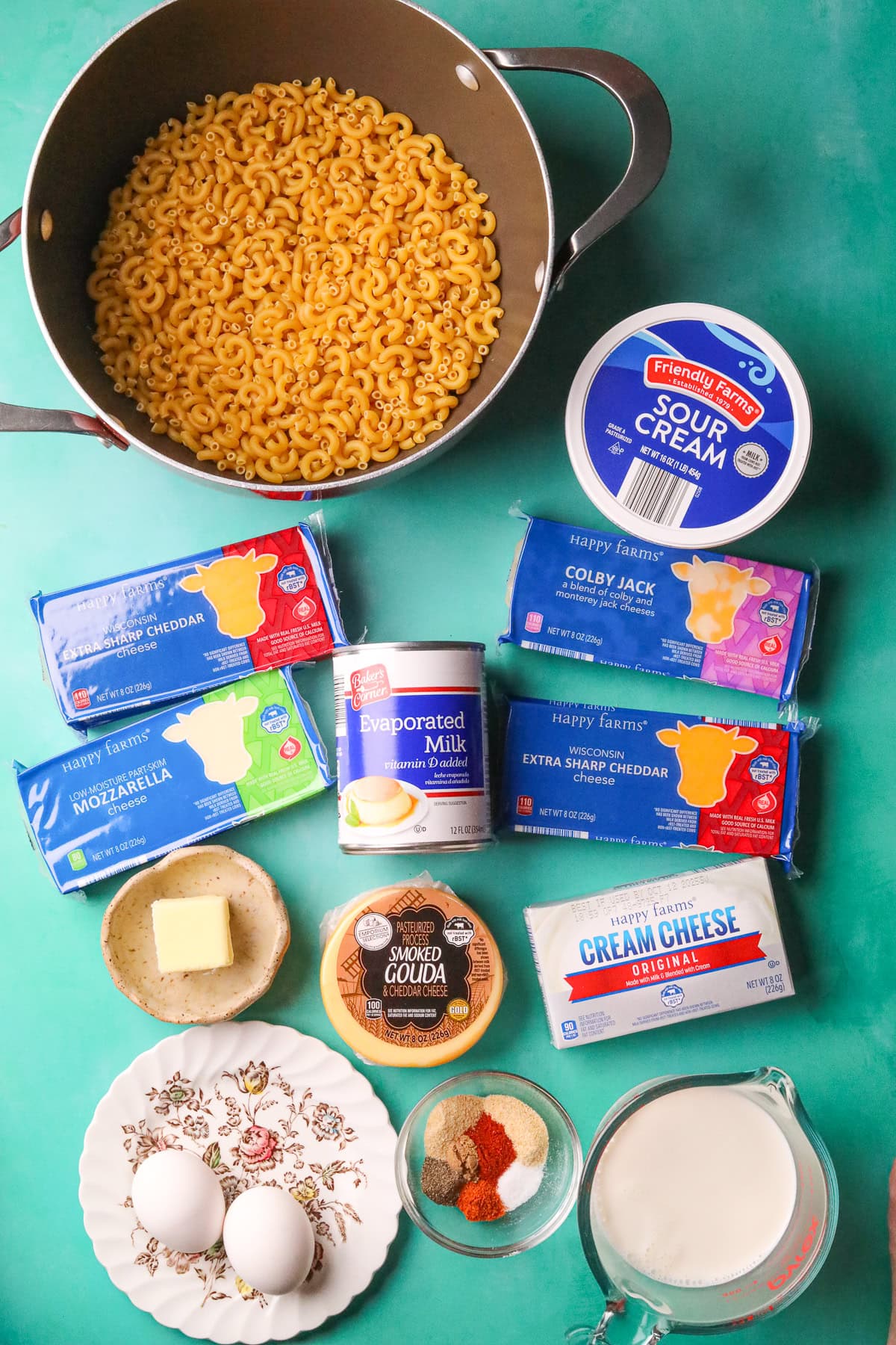 Ingredients for making creamy southern baked mac & cheese arranged on a table.