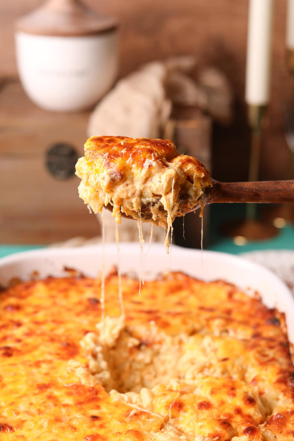 A serving of creamy southern baked mac & cheese on a serving spoon.